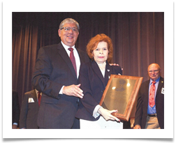 Phil Goldfarb, OMA Alumni Association President, presents Raqui with the LTG William Potts Award Phil Goldfarb, OMA Alumni Association President, presents Raqui with the LTG William Potts Award