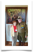 Jeffrey L. Maahs and Raqui in front of the painting of the Last Cavalry Charge in the Museum Jeffrey L. Maahs and Raqui in front of the painting of the Last Cavalry Charge in the Museum