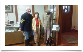 Col. Sam Young, Editor, U.S. Cavalry Journal with Raqui beside Ed's uniform and boots at the U.S. Cavalry Museum Col. Sam Young, Editor, U.S. Cavalry Journal with Raqui beside Ed's uniform and boots at the U.S. Cavalry Museum