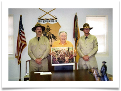 Ed holding print with Cavalry Troopers on each side