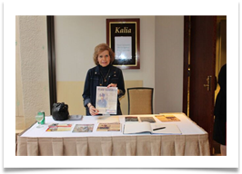 Dr. Ramsey at the reception table with a copy of the invitation/flyer Dr. Ramsey at the reception table with a copy of the invitation/flyer